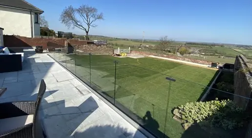 Frameless glass balustrade for a modern garden terrace