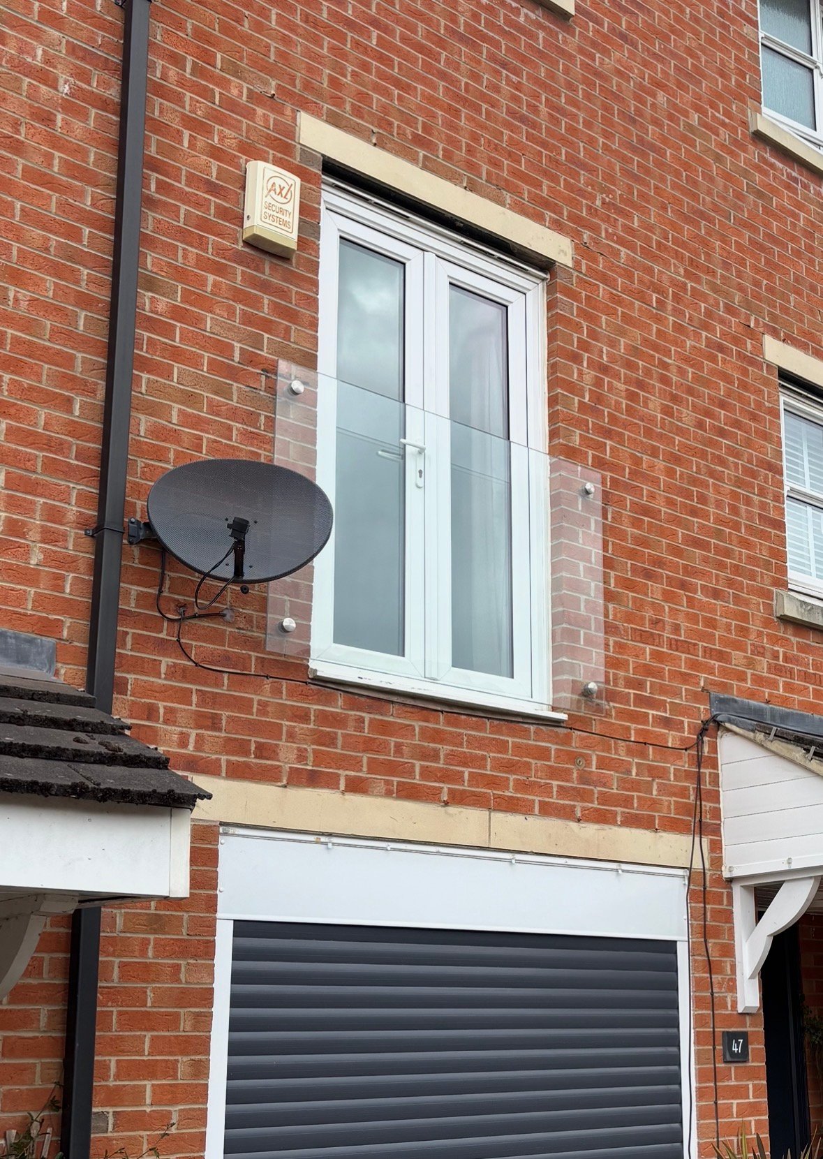 Glass Juliet balcony for upper-floor doors and windows