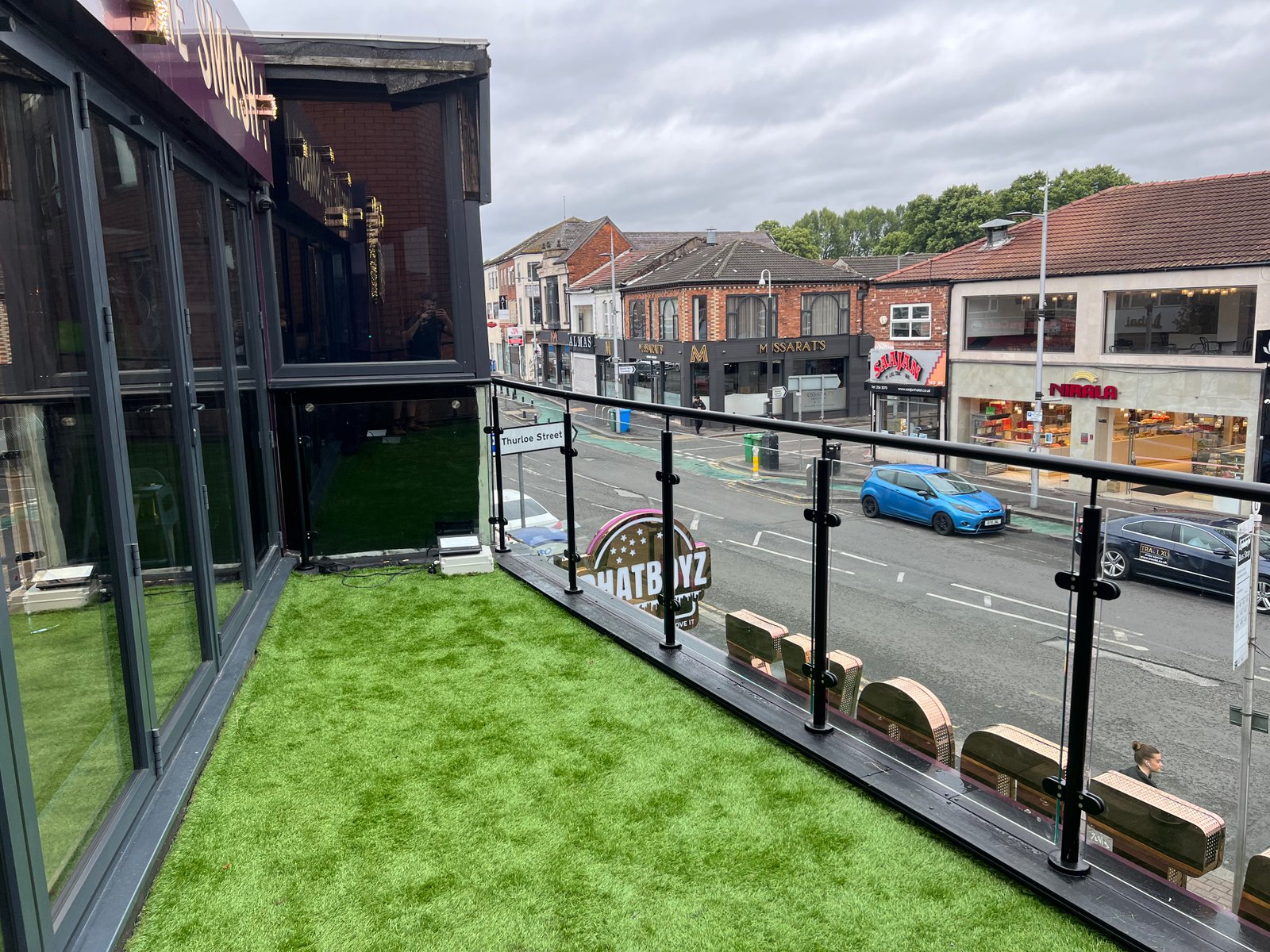 Post and glass balustrade with stainless steel posts